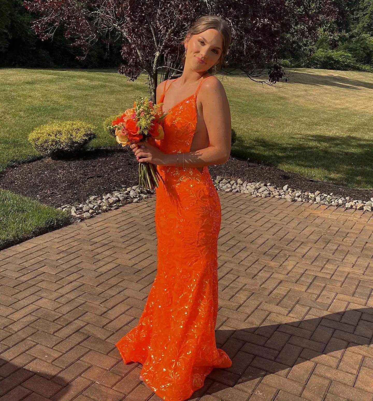 Model wearing a orange gown